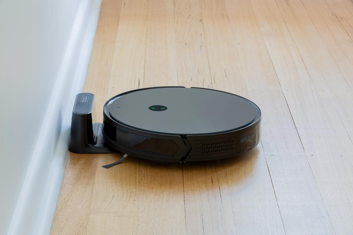 RV2200 Robot Vacuum with glass top and a charging dock.